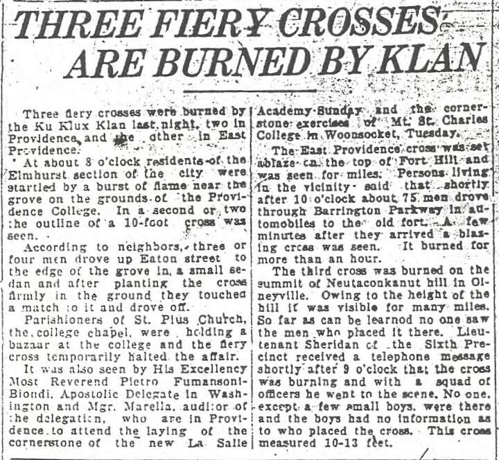 Newspaper clipping with the headline 'THREE FIERY CROSSES ARE BURNED BY KLAN,' reporting Ku Klux Klan cross burnings in Providence and East Providence.