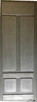 A plaque that lists alumni who donated to five statues on the facade of Harkins Hall.