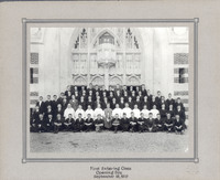 The first entering class on Opening Day, September 18, 1919, posed in front of a Gothic-style building entrance, with individuals dressed formally in suits and ties.