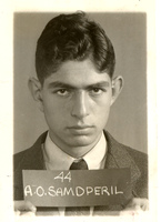 Portrait of Alfred Samdperil wearing a suit and tie posing in front of a light background.