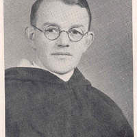 Portrait of Reverend Lorenzo C. McCarthy, O.P., wearing round glasses and a clerical robe.